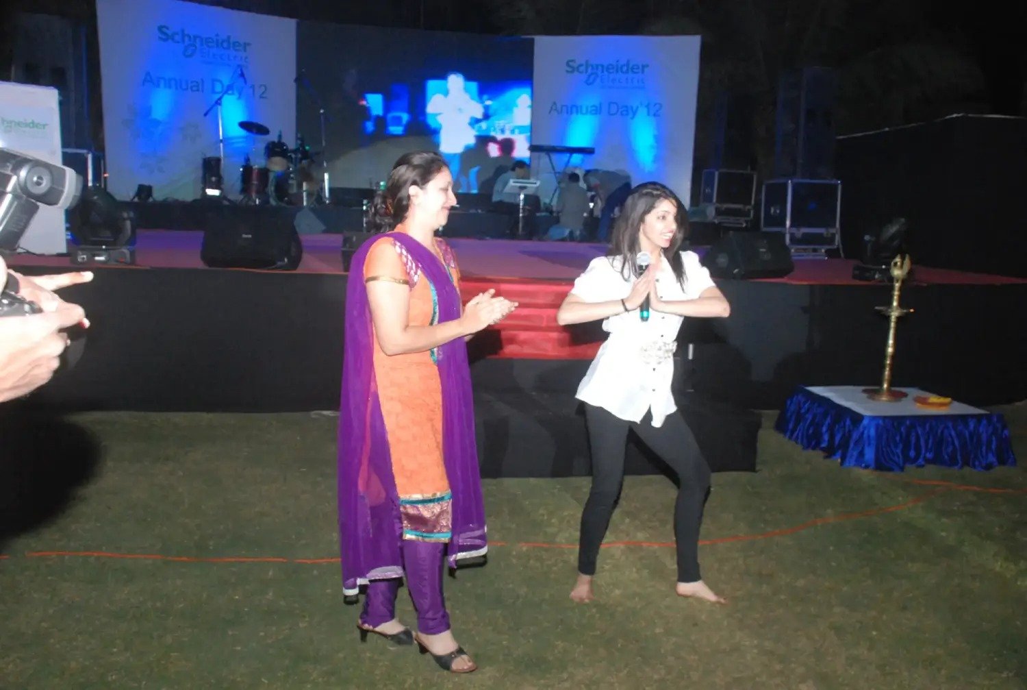 Man in suit speaking at podium with ITT logo on podium